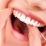 limpiar los dientes con seda dental